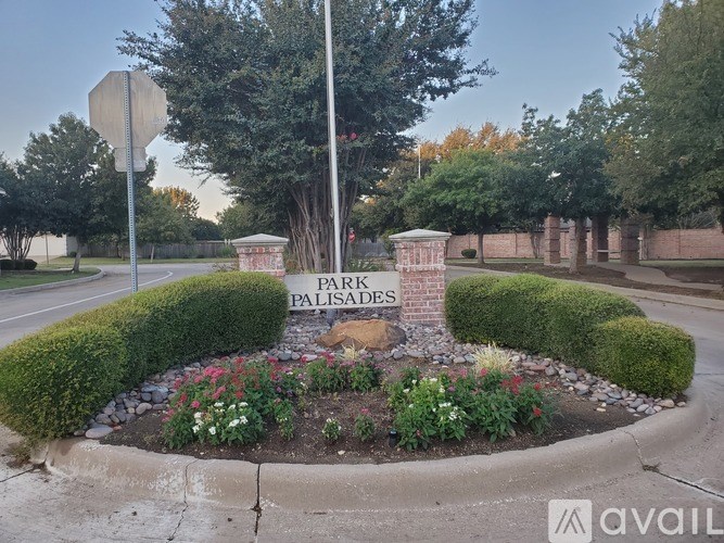 A garden with a sign that says Park Palisades.