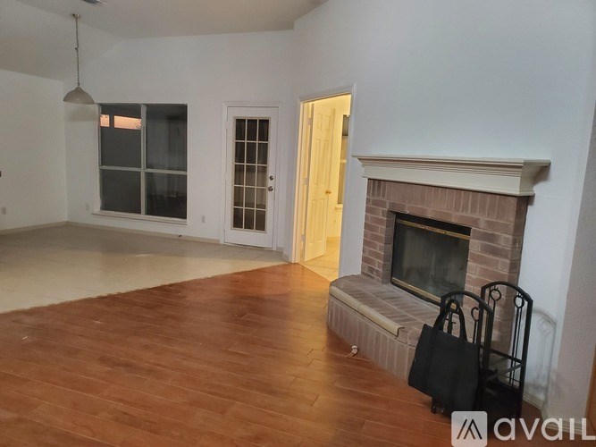 A room with a fireplace and a bench.