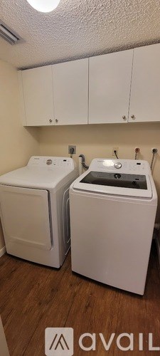 A laundry room with a washer and dryer.