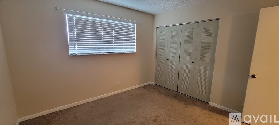 A room with a window and a wardrobe.