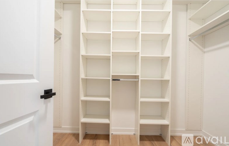 A white shelving unit with multiple shelves.