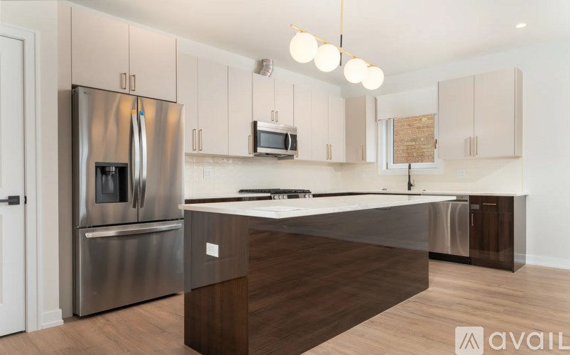 A modern kitchen with a stainless steel refrigerator and wooden countertops.