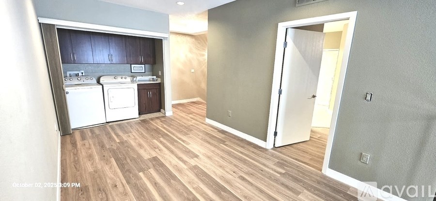 A kitchen with a washer and dryer built in.