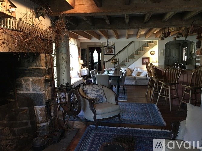 A living room with a fireplace and a couch.