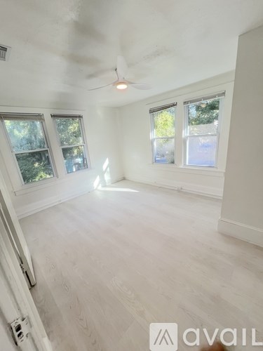 A bathroom with a toilet and a walk-in shower.