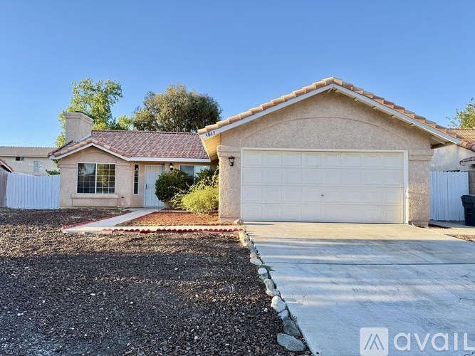 A house with a garage is available for sale.