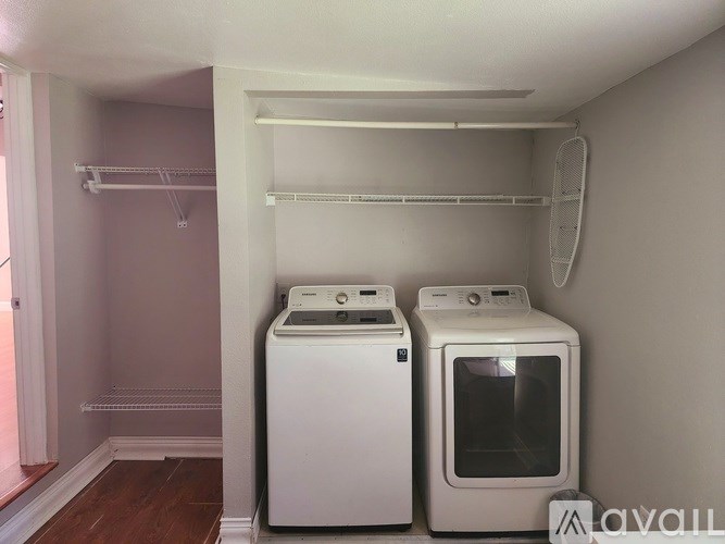 A laundry room with a washer and dryer.