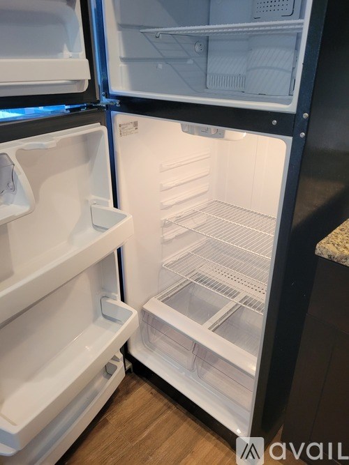 Two refrigerators, one with its door open, are shown.