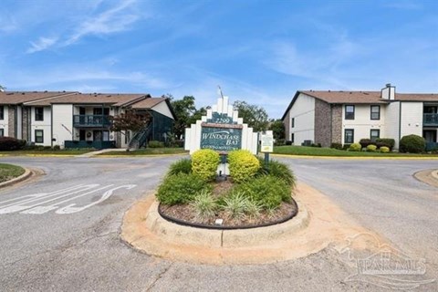 The image shows a sign for Weston Bay in front of a building.