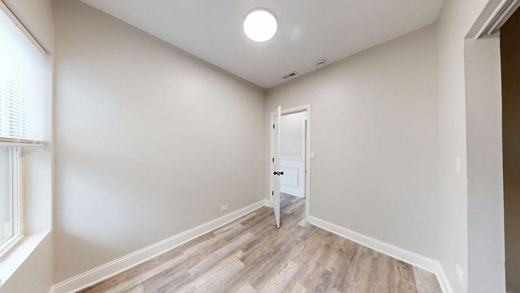 A room with a door and a window.