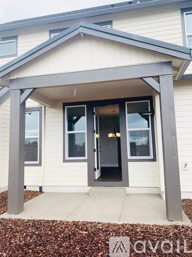 A house with a front porch and a covered entrance.
