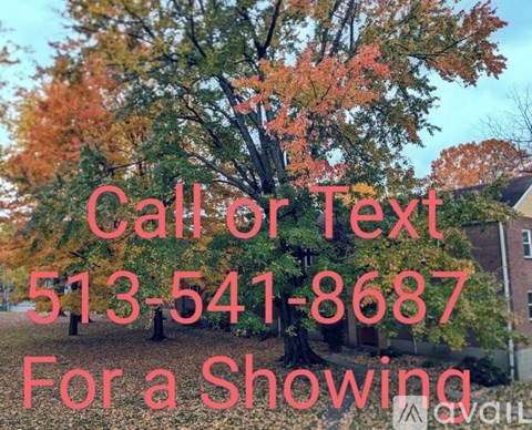 A tree with autumn leaves is in the background with text overlay that reads "Call or Text 513-541-8687 For a Showing".