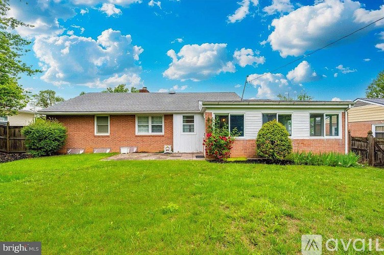 A house with a lawn in front of it is for sale.
