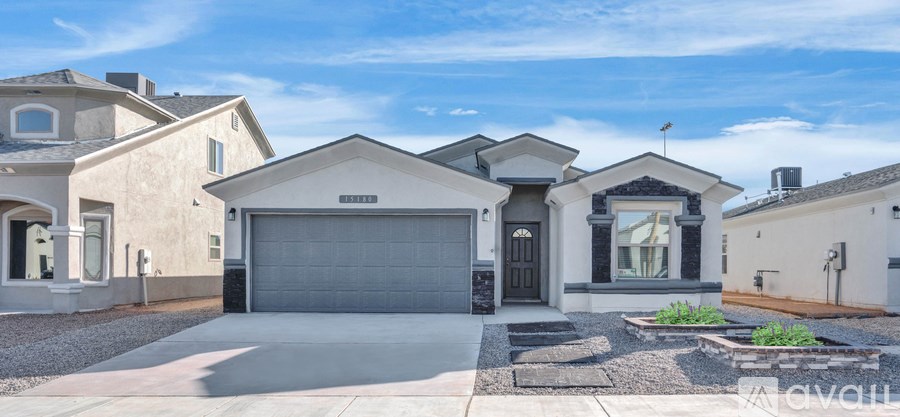 A modern house with a garage and a driveway.
