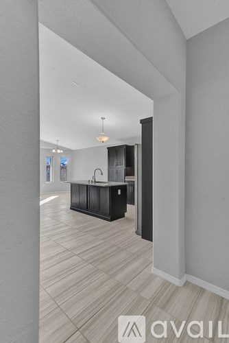 A modern kitchen with a large island in the middle.