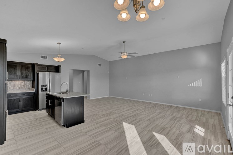 A kitchen area with a bar and a sink is available for rent.