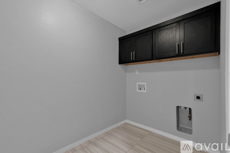 A room with a wall-mounted cabinet and a light switch.