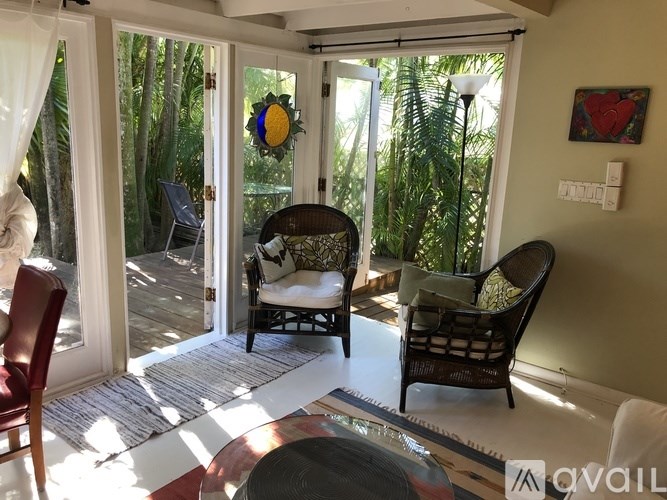 A patio with a table, chairs and a sun catcher.