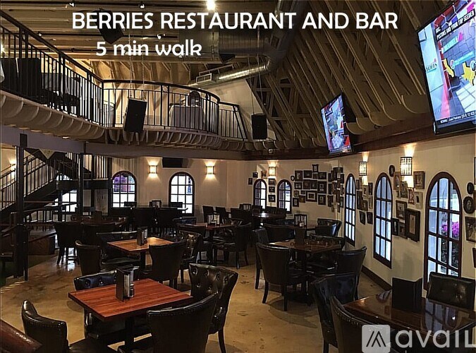 A restaurant and bar with a sign that says Berries Restaurant and Bar.