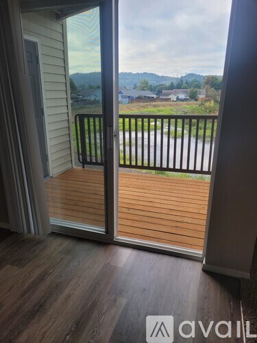 A balcony with a view of a residential area.