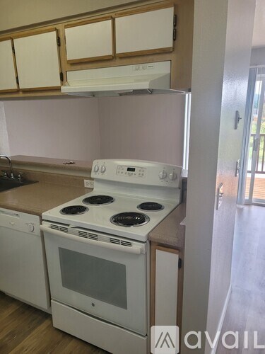 A white stove and oven in a kitchen.