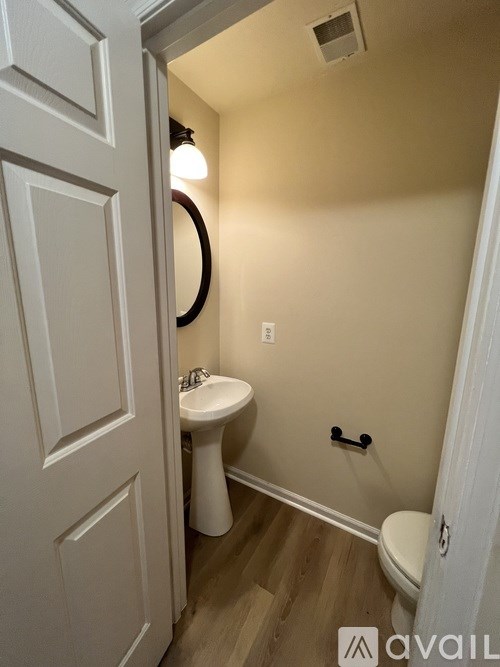 A small bathroom with a toilet and sink.