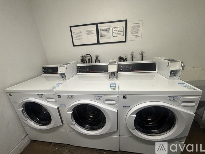 A row of washing machines are available for purchase.