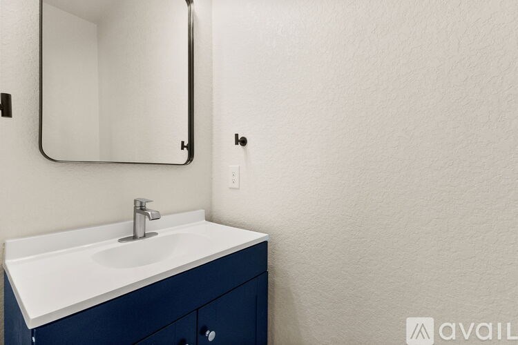 A bathroom sink with a mirror above it.