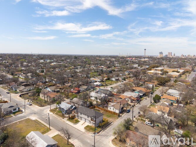 A bird's eye view of a residential area with houses and streets.