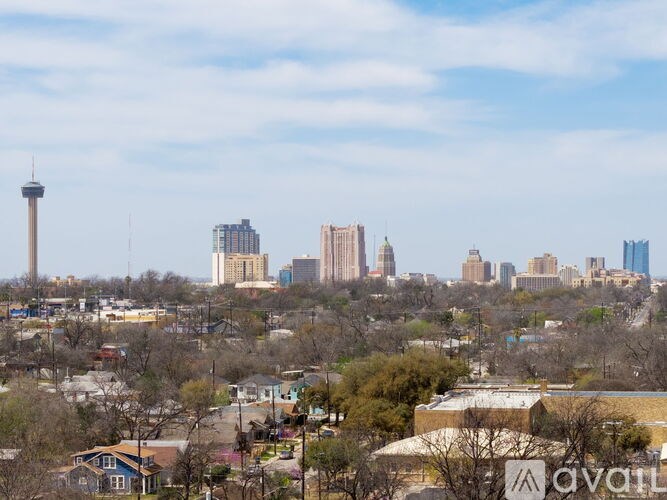 A cityscape with a tall tower in the background.