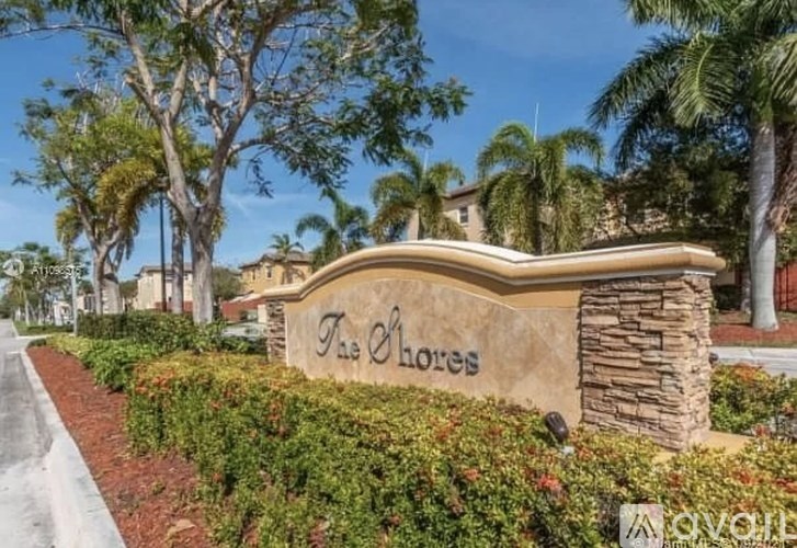 A sign that says "The Chores" is in front of a building.