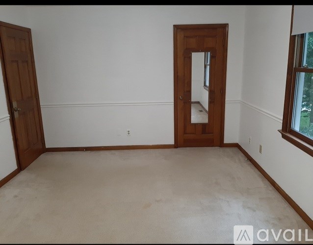 A room with a door and a window.