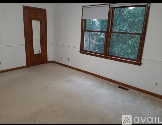 A room with a door and a window.