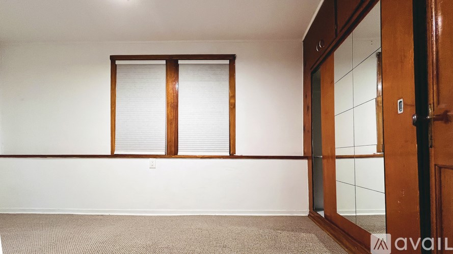 A room with a window and a door.