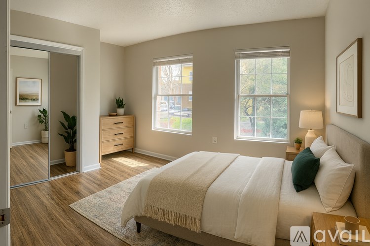 A room with a window and wooden flooring.