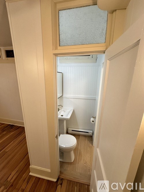 A small bathroom with a toilet and sink.