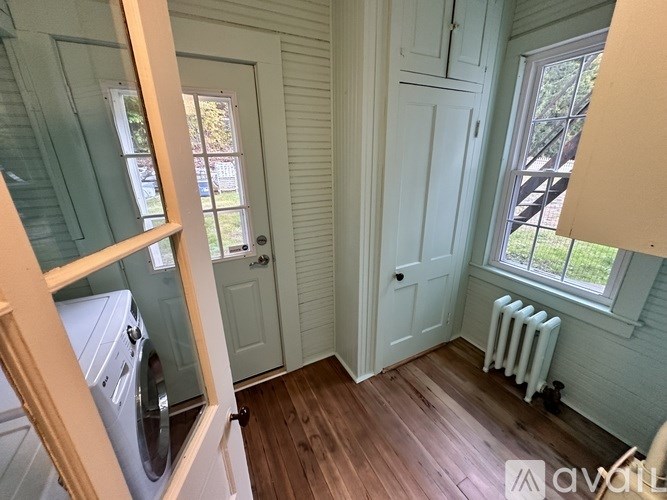 A room with a washer and dryer in it.