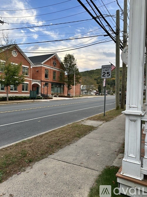 A street view with a speed limit sign of 25 mph.