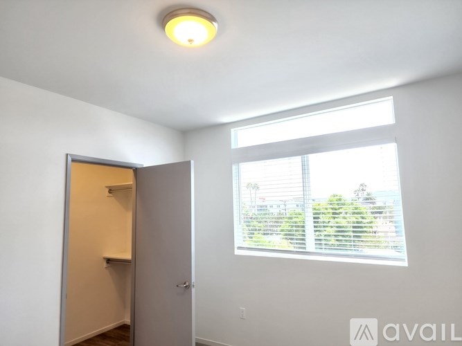 A small room with a window and a door.