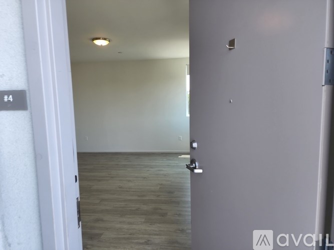 A room with a door and a wall with a number 4 on it.