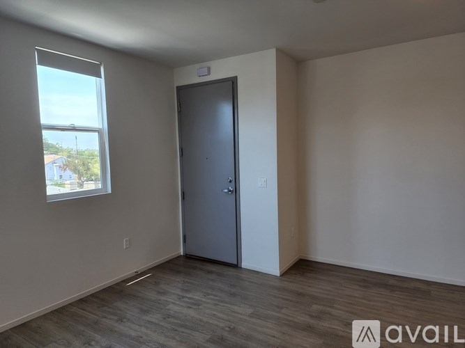 A room with a door and a window.