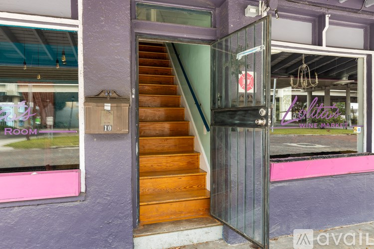 A glass door with a sign that says "Ladies" on it.