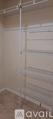 Empty shelves in a white room.