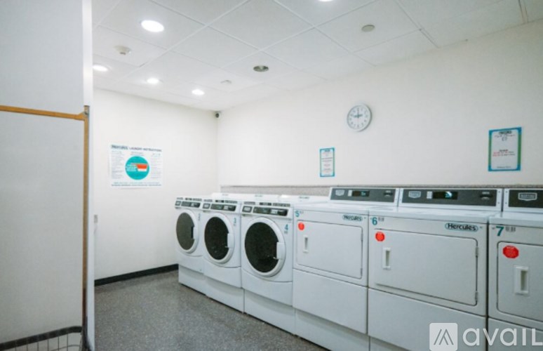 A row of washing machines in a laundromat.