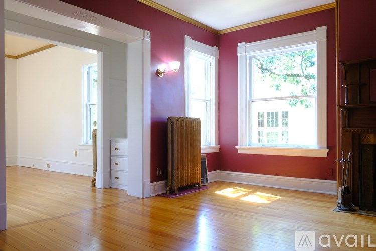 A room with red walls and a white door.