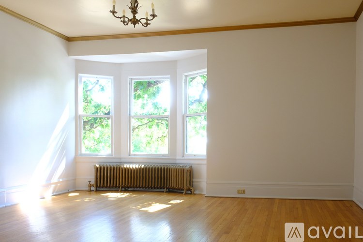A room with a window and a radiator.