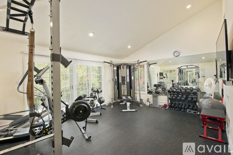 A well-equipped gym with a variety of exercise machines.