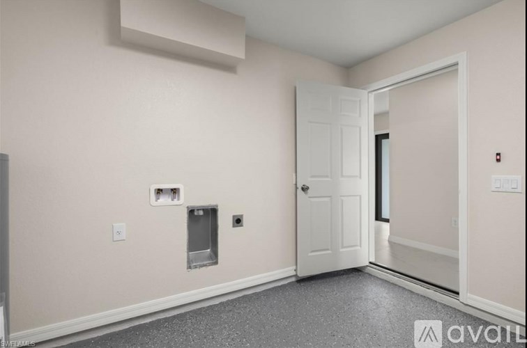 A room with a door and a window on the wall.