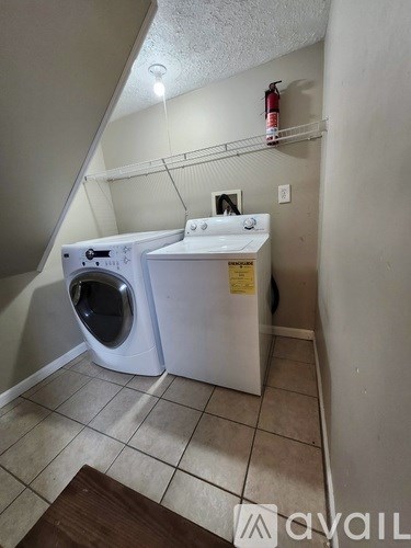 A laundry room with a washer and dryer.