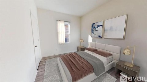 A bedroom with a bed, nightstand, and two framed pictures on the wall.